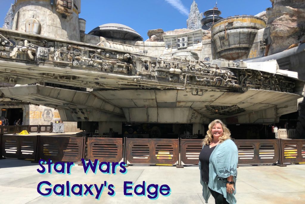Author Elizabeth Van Tassel in front of the Millenium Falcon from Galaxy's Edge at Disneyland