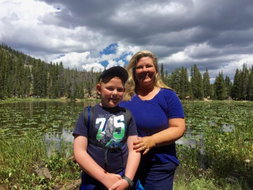 Author Elizabeth Van Tassel with her son next to Nymph Lake, CO.