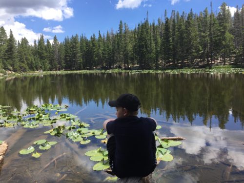 Our son Joey with the wide view of Nymph Lake with author Elizabeth Van Tassel