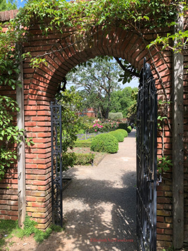 Garden gate at Filoli Gardens with author Elizabeth Van Tassel